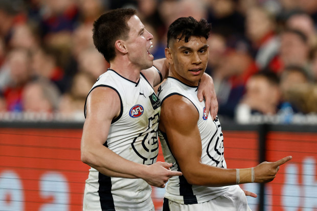 MELBOURNE, AUSTRALIA - SEPTEMBER 15: Matthew Owies (left) and Jesse Motlop of the Blues celebrate during the 2023 AFL First Semi Final match between the Melbourne Demons and the Carlton Blues at Melbourne Cricket Ground on September 15, 2023 in Melbourne, Australia. (Photo by Michael Willson/AFL Photos via Getty Images)