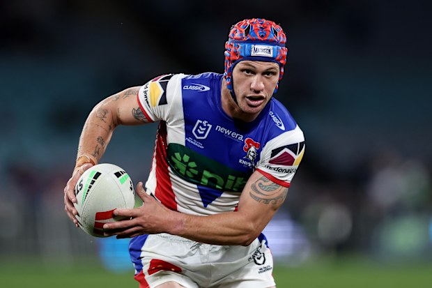 Kalyn Ponga of the Knights runs with the ball during the round 25 NRL match between South Sydney Rabbitohs and Newcastle Knights at Accor Stadium, on August 24, 2024, in Sydney, Australia. 