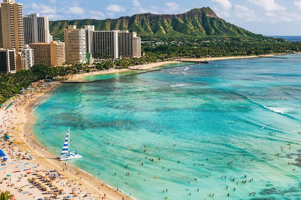 Hawaii beach Honolulu city travel landscape of Waikiki beach and Diamond Head mountain peak at sunset, Oahu island, USA vacation.