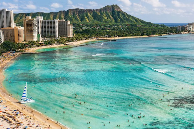 Hawaii beach Honolulu city travel landscape of Waikiki beach and Diamond Head mountain peak at sunset, Oahu island, USA vacation.
