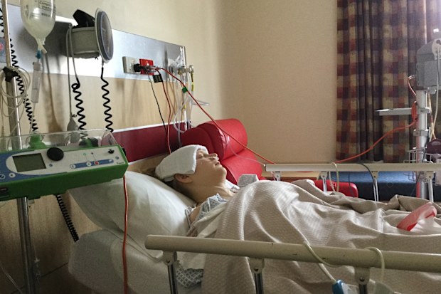 Natalie Diepenhorst in hospital during bowel cancer treatment.