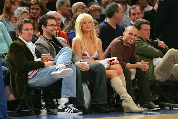 NEW YORK - NOVEMBER 23:  Paris Hilton and Ethan Hawke (L)  watch game action between the Atlanta Hawks and the New York Knicks on November 23, 2004 at Madison Square Garden in New York City, New York. The Knicks defeated the Hawks 104-88.  NOTE TO USER: User expressly acknowledges and agrees that, by downloading and/or using this Photograph, user is consenting to the terms and conditions of the Getty Images License Agreement.  (Photo by Ezra Shaw/Getty Images) *** Local Caption *** Paris Hilton