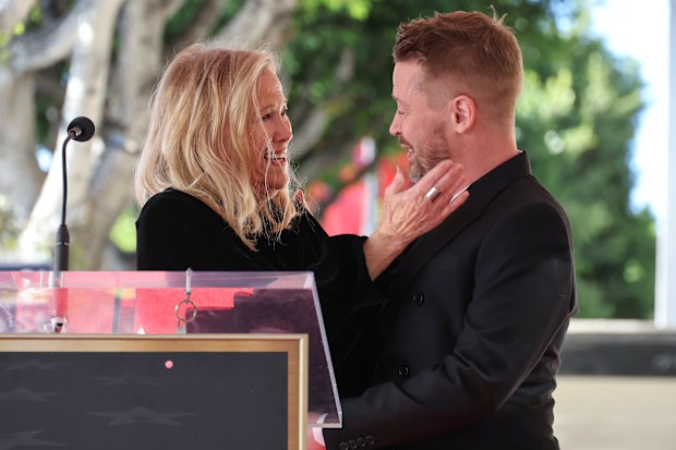 Catherine O'Hara and Macaulay Culkin speak onstage during the ceremony honoring Macaulay Culkin with a Star on the Hollywood Walk of Fame on December 01, 2023