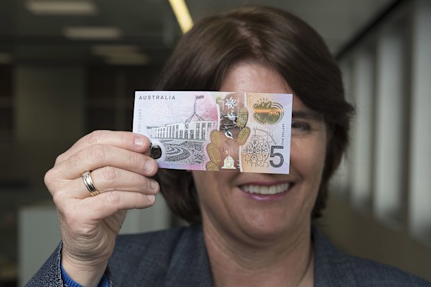 Michele Bullock with the new $5 Australian note in 2016.
