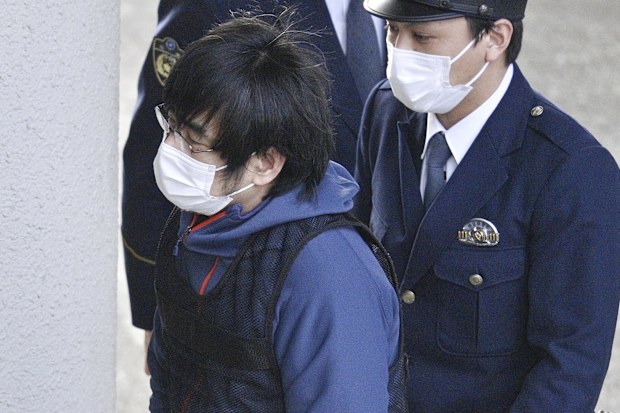 Tetsuya Yamagami, the alleged assassin of Japan's former Prime Minister Shinzo Abe, enters a police station in Nara, western Japan, on Jan. 10, 2023.  