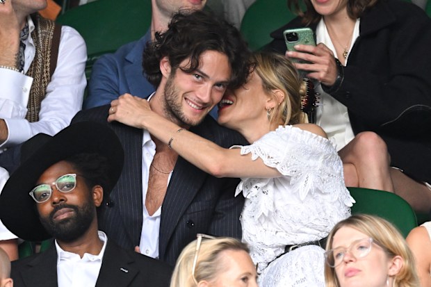 Oli Green and Sienna Miller attend Day 7 of the Wimbledon Tennis Championships at the All England Lawn Tennis and Croquet Club on July 03, 2022 in London, England. 