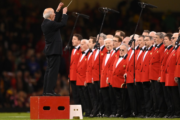 The conductor and the choir entertain the crowd prior to the Six Nations Rugby match between Wales and Ireland at Principality Stadium.