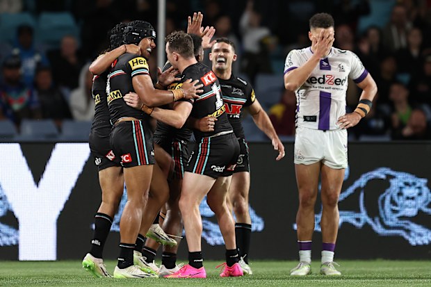 SYDNEY, AUSTRALIA - SEPTEMBER 22:  Dylan Edwards of the Panthers celebrates with team mates after scoring a try during the NRL Preliminary Final match between the Penrith Panthers and Melbourne Storm at Accor Stadium on September 22, 2023 in Sydney, Australia. (Photo by Brendon Thorne/Getty Images)