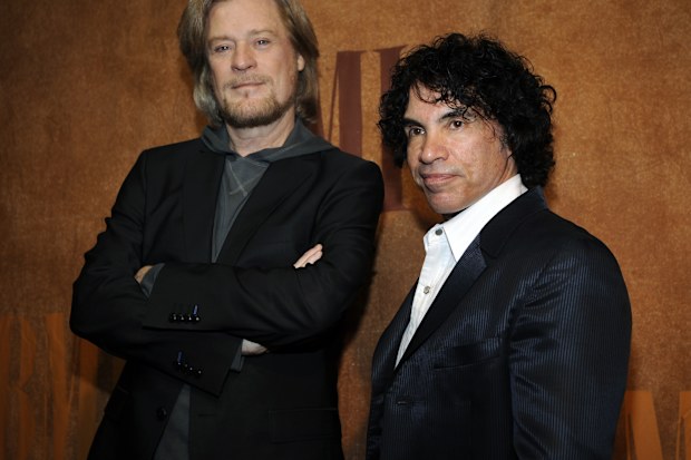 FILE - Daryl Hall, left, and John Oates, recipients of BMI Icons awards, pose together before the 56th annual BMI Pop Awards in Beverly Hills, Calif., on May 20, 2008.   Hall has sued his longtime music partner John Oates, arguing that his plan to sell off his share of a joint venture would violate a business agreement the duo had.(AP Photo/Chris Pizzello, File)