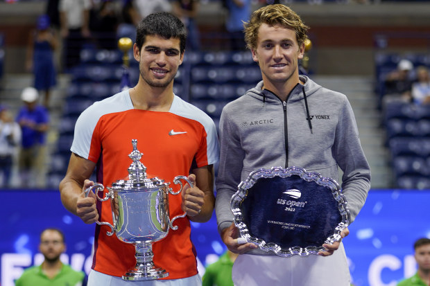 Carlos Alcaraz, of Spain, and Casper Ruud, of Norway, pose for a photo after the men's singles final of the U.S. Open tennis championships, Sunday, Sept. 11, 2022, in New York. (AP Photo/Charles Krupa)