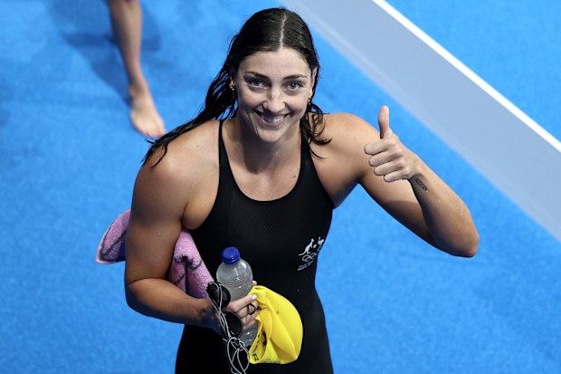 Meg Harris of Team Australia gestures a thumbs up after winning gold in the Women's 4x100m Freestyle Relay Final on day one of the Olympic Games Paris 2024 at Paris La Defense Arena on July 27, 2024 in Nanterre, France. 