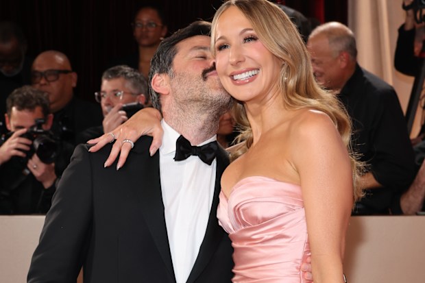 Chris Convy and Nikki Glaser attend the 83rd Annual Golden Globe Awards at The Beverly Hilton on January 11, 2026 in Beverly Hills, California. 