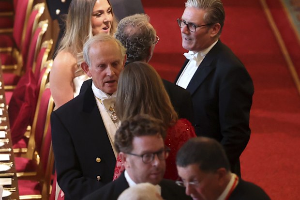 Mary Earps, top, and Briain's Prime Minister Keir Starmer, center right, attend the State Banquet for the President of France Emmanuel Macron, and his wife Brigitte Macron, at Windsor Castle, in Windsor, England, Tuesday, July 8, 2025. (Chris Jackson/Pool Photo via AP)