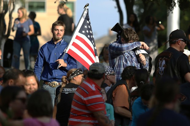 Hundreds of people gathered at a local university in the Permian Basin region known for its oil industry on Sunday evening for a prayer vigil to console each other and grieve the loss of life.