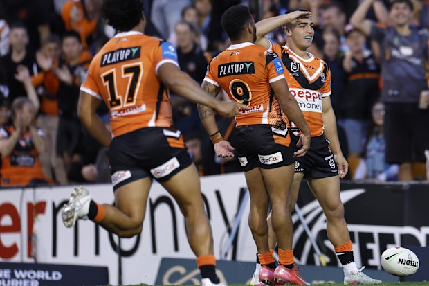 Tallyn Da Silva celebrates scoring a try for Wests Tigers.