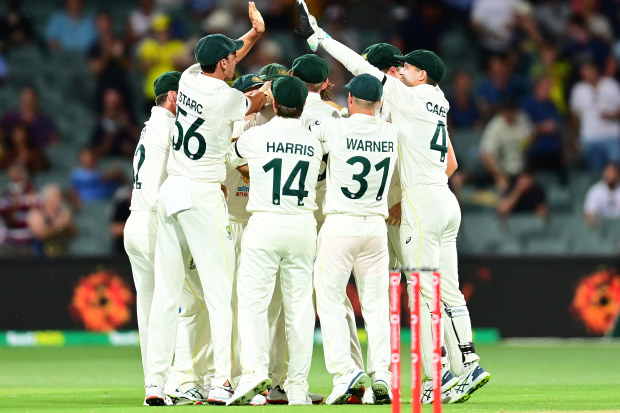Michael Neser celebrates with his Australian team mates after taking the wicket of Haseeb Hameed.