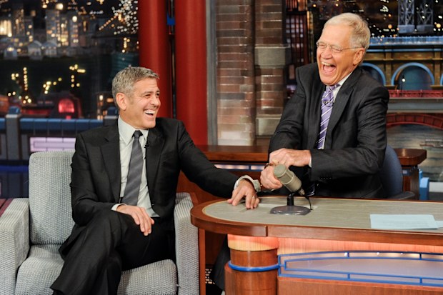 George Clooney handcuffs himself to Dave in an attempt to keep Dave from leaving the show, on the Late Show with David Letterman, Thursday May 14, 2015 on the CBS Television Network. 