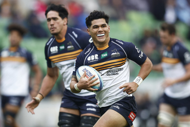 Noah Lolesio of the Brumbies runs in to score a try.