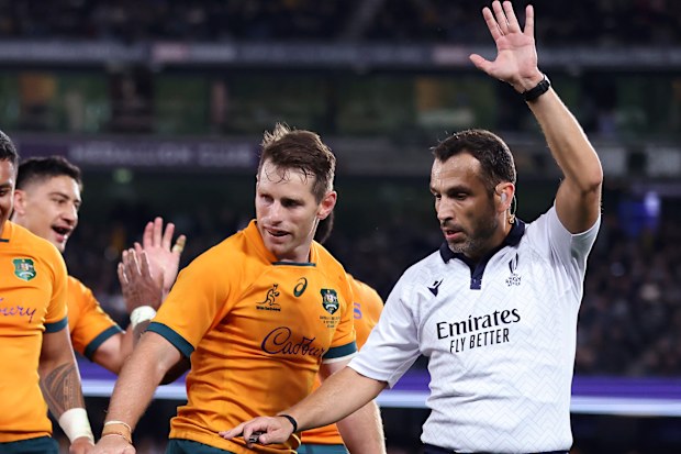 Referee Mathieu Raynal and Australia's Bernard Foley.