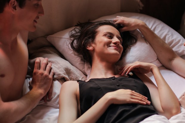 Three people in bed