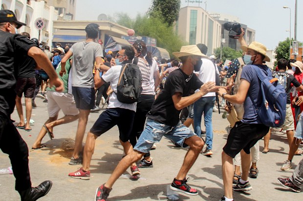 Thousands of people defied COVID-19 restrictions and heat to demonstrate in the capital of Tunis and other cities.