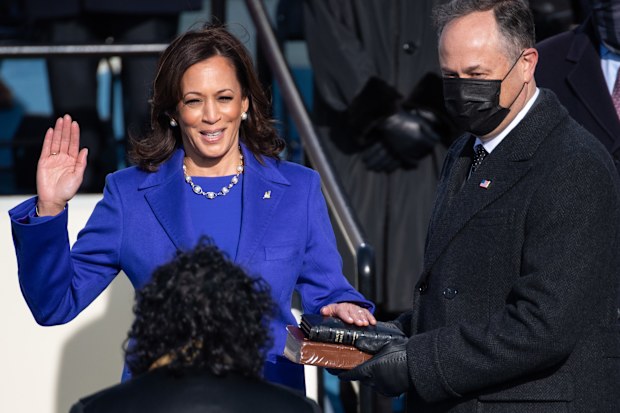 Kamala Harris is sworn in as vice president by Supreme Court Justice Sonia Sotomayor as her husband Doug Emhoff holds the Bible during the 59th Presidential Inauguration