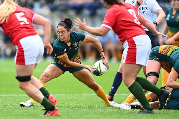 Iliseva Batibasaga of Australia passes during the Pool A Rugby World Cup 2021 match between Australia and Wales