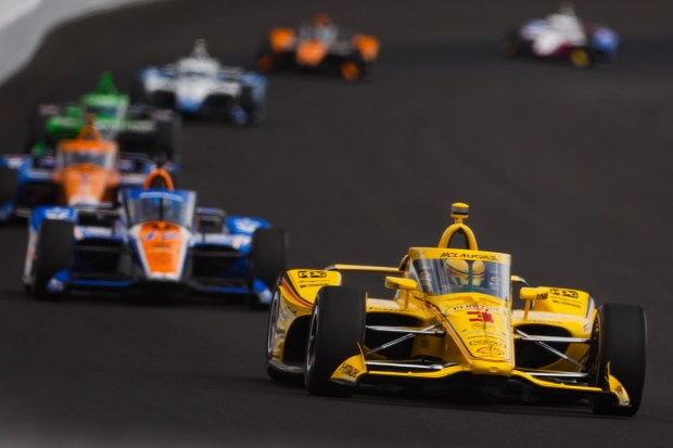 Scott McLaughlin leads a pack of cars in practice for the 108th Indianapolis 500.
