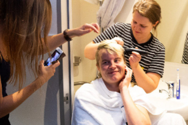 Sarah has her head shaved before the operation.