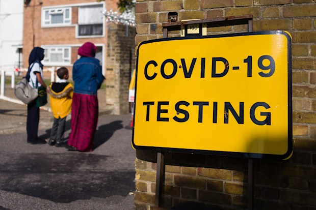 LONDON, UNITED KINGDOM - SEPTEMBER 18: Signs direct members of the public to a COVID-19 testing centre on September 18, 2020 in east London, United Kingdom. The Government is currently considering a short period of national lockdown in a bid to slow a second wave in the pandemic, after it was announced that hospitalisations due to the coronavirus in London have doubled every eight days over recent weeks. (Photo by Leon Neal/Getty Images)