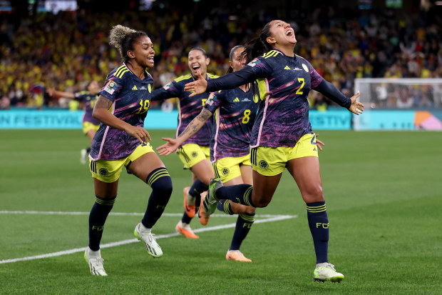 Manuela Vanegas of Colombia celebrates with teammates after scoring her team's second goal.