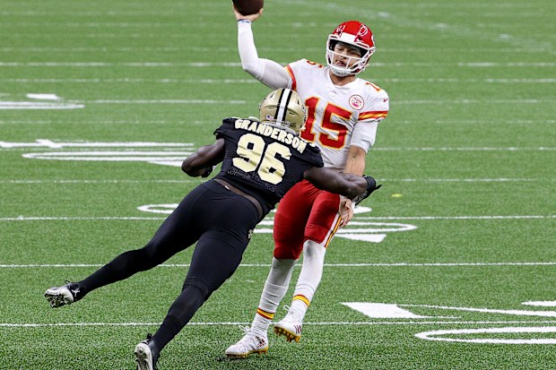 Patrick Mahomes of the Kansas City Chiefs throws under pressure by Carl Granderson of the New Orleans Saints.