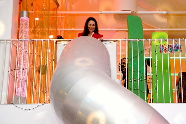 Kate, Duchess of Cambridge stands at the top of a slide before using it at the Lego Foundation PlayLab on Campus Carlsberg in Copenhagen, Tuesday, Feb. 22, 2022.