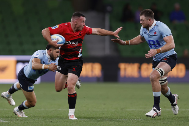 Ryan Crotty runs with the ball during the round two Super Rugby Pacific match between Crusaders and NSW Waratahs.