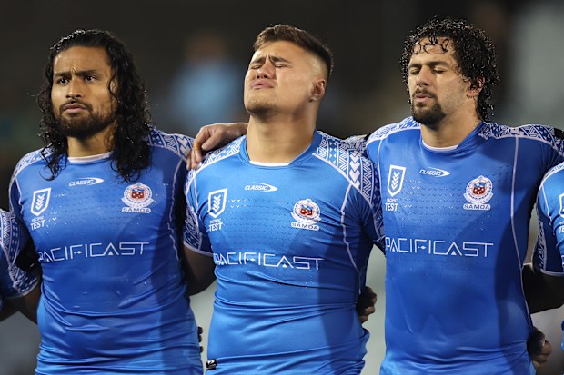 Bunty Afoa, Josh Schuster and Josh Aloiai of Samoa sing the national anthem ahead of the Test match between Samoa and the Cook Islands at Campbelltown Sports Stadium.