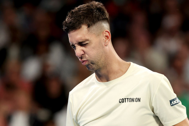 Thanasi Kokkinakis of Australia reacts in their round two singles match against Grigor Dimitrov.