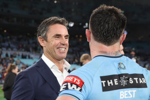 Blues coach Brad Fittler celebrates with Bradman Best of the Blues after game three of the State of Origin series.
