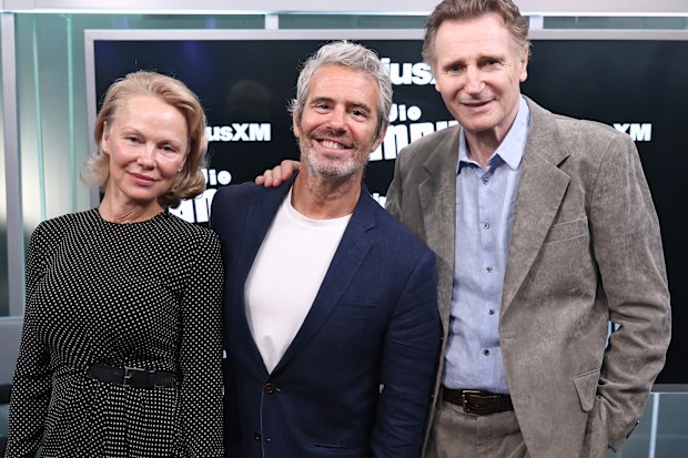 NEW YORK, NEW YORK - JULY 30: (L-R) Pamela Anderson, Andy Cohen and Liam Neeson attend SiriusXM's Town Hall with the cast of "The Naked Gun" hosted by Andy Cohen at SiriusXM Studios on July 30, 2025 in New York City.  (Photo by Cindy Ord/Getty Images for SiriusXM)