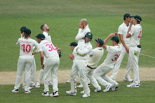 Australian players react after an unsuccessful DRS challenge.