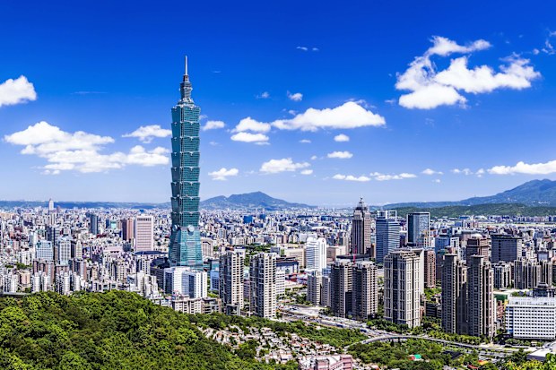 Taipei, Taiwan- July 20, 2012: Amazing view of Taipei from top of the mountain, Taiwan. Skyscrapers and other modern buildings of downtown. Scenic Taipei skyline. Amazing cityscape. Taiwan is a popular tourist destination in Asia.