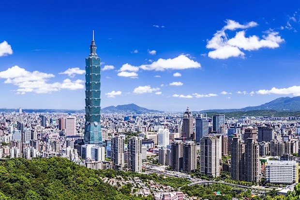 Taipei, Taiwan- July 20, 2012: Amazing view of Taipei from top of the mountain, Taiwan. Skyscrapers and other modern buildings of downtown. Scenic Taipei skyline. Amazing cityscape. Taiwan is a popular tourist destination in Asia.