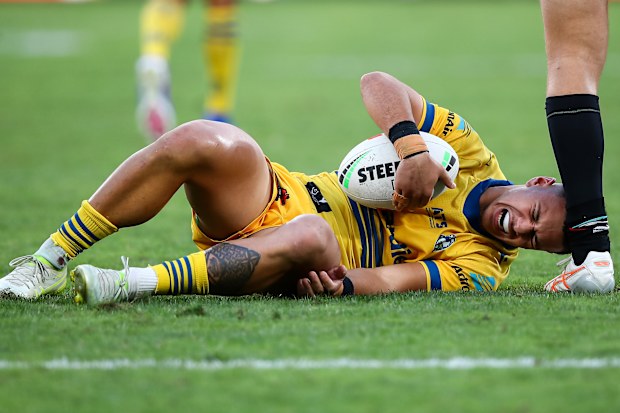 Isaiah Iongi reacts after a hip-drop tackle.