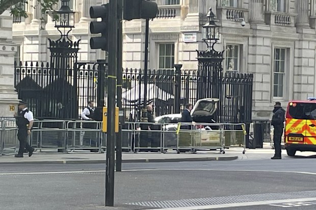 Police at the scene after a car collided with the gates of Downing Street in London Thursday May 25, 2023.