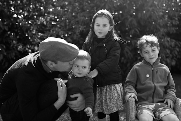 Undated handout photo issued by Kensington Palace on Wednesday Dec. 25, 2019 of Britain's Prince William with his children Prince Louis, Princess Charlotte and Prince George taken in Norfolk earlier this year by his wife Kate, Duchess of Cambridge. (Kate, The Duchess of Cambridge via AP)