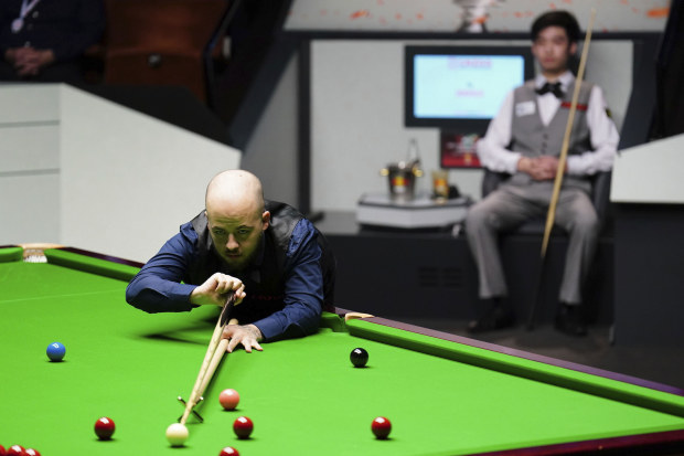 Belgium's Luca Brecel in action against China's Si Jiahui at the World Snooker Championship.