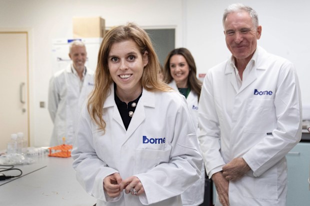 Princess Beatrice, front, Patron of Borne, and the television presenter, meteorologist and new Borne Ambassador, Laura Tobin, second right, visit the Borne research laboratories at Chelsea and Westminster Hospital in London, England, Monday, Nov. 10, 2025. (Stefan Rousseau/PA via AP)