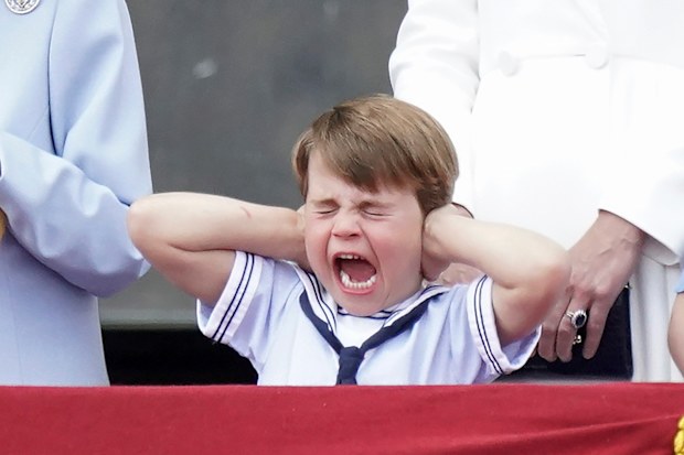 Prince Louis covers his ears from the balcony of Buckingham Place during a fly-past after the Trooping the Color ceremony in London, Thursday, June 2, 2022, on the first of four days of celebrations to mark the Platinum Jubilee. The events over a long holiday weekend in the U.K. are meant to celebrate the monarch's 70 years of service.
