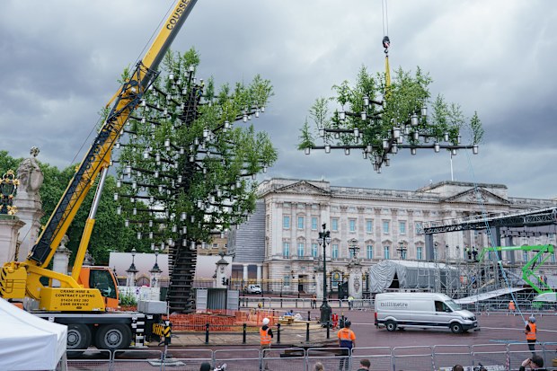 A team of workers add the final parts to the Queen's Green Canopy ahead of the Platinum Jubilee on May 24, 2022 in London, England.