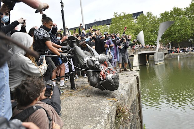 Edward Colston, Bristol's most famous philanthropist, is pushed into the harbour.