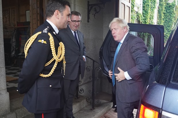 Outgoing Prime Minister Boris Johnson is greeted by the Queen Elizabeth II's Equerry Lieutenant Colonel Tom White and her private Secretary Sir Edward Young as he arrives for an audience to formally resign as Prime Minister at Balmoral Castle on September 6, 2022 in Aberdeen, Scotland.  